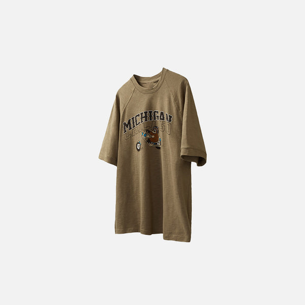 Front view of the khaki MICHIGAN Vintage Motorcycle Bear T-shirt in a gray background 