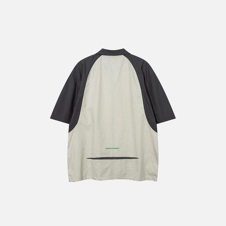 Back view of the green Splicing Color Zip-up Shirt in a gray background 