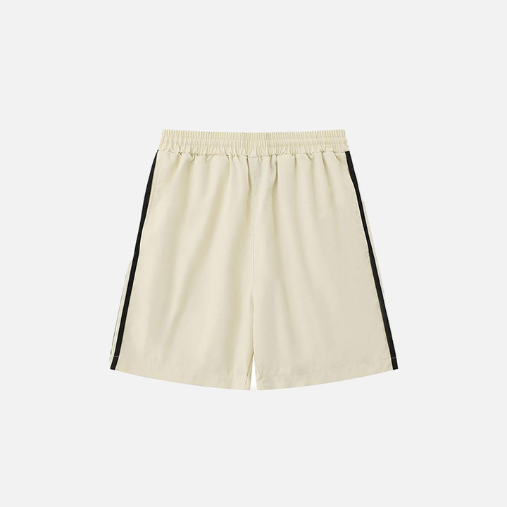 Back view of the beige Side Striped Sports Shorts in a gray background 
