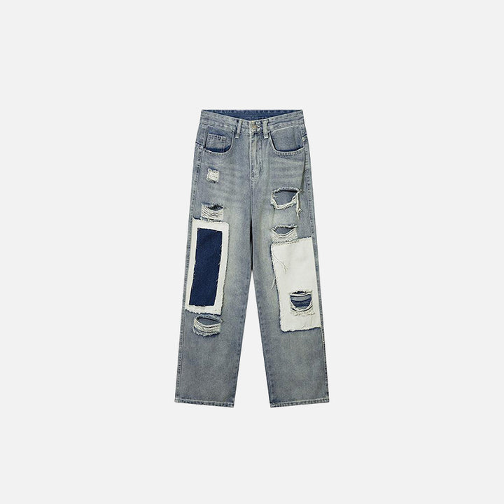 Front view of the Distressed Straight Patchwork Jeans in a gray background 