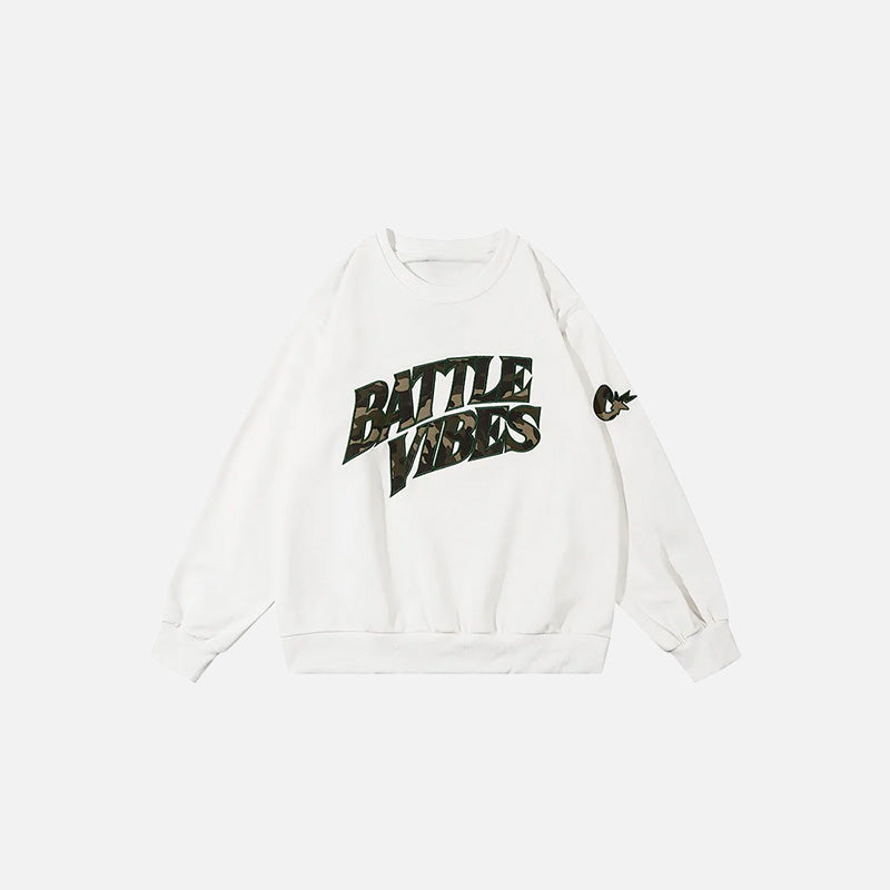 Front view of the white Battle Vibes Camo Sweatshirt in a gray background