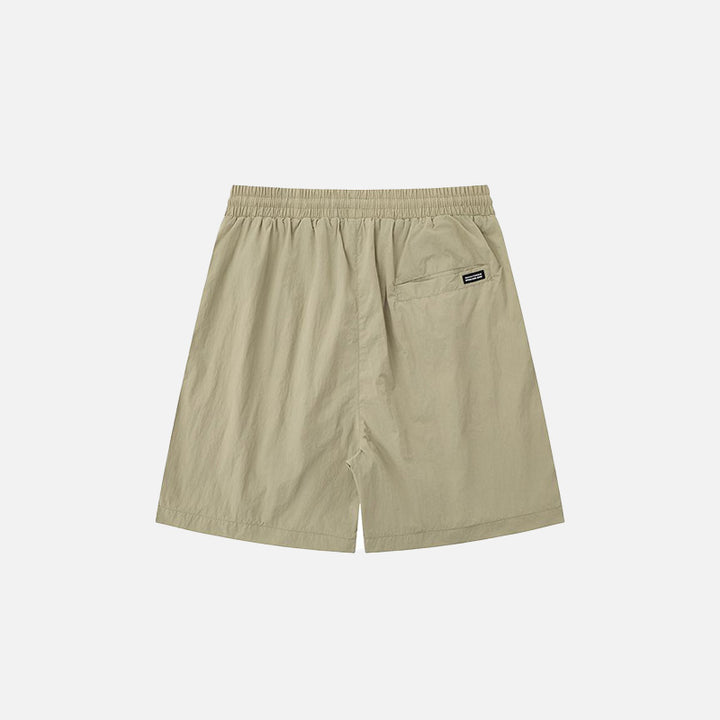 Back view of the khaki Loose Solid Color Sports Shorts in a gray background 
