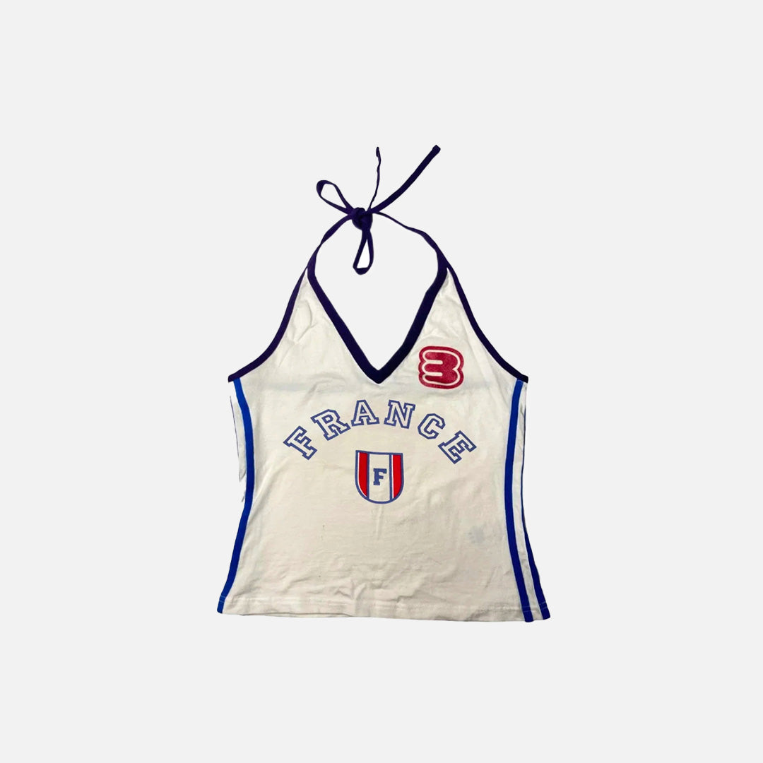 Front view of the beige Halter 90s Style France Top in a gray background