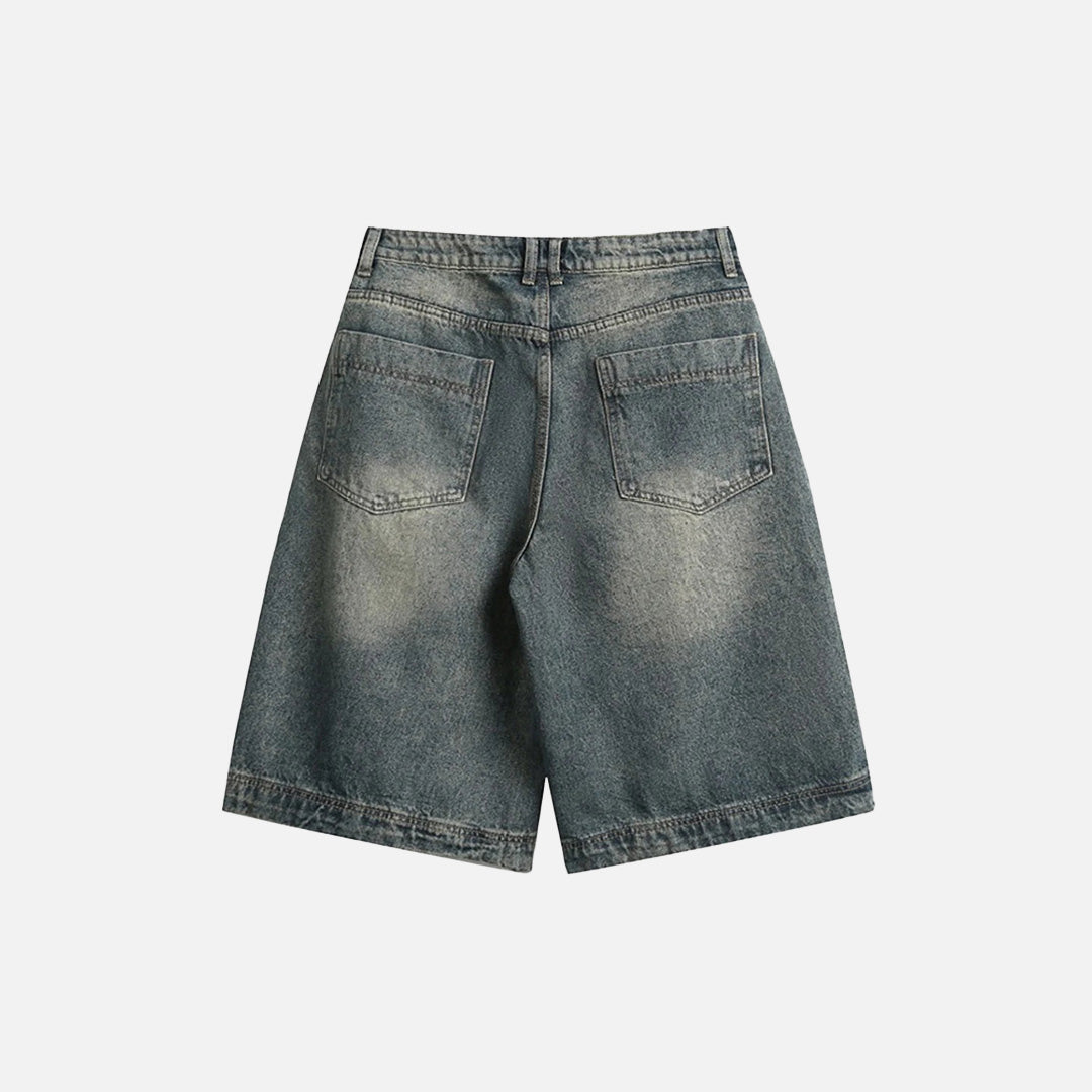 Back view of the blue Classic Wide-Leg Denim Shorts in a gray background