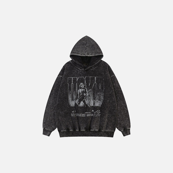 Front view of the black Oversized Music Hoodie in a gray background 