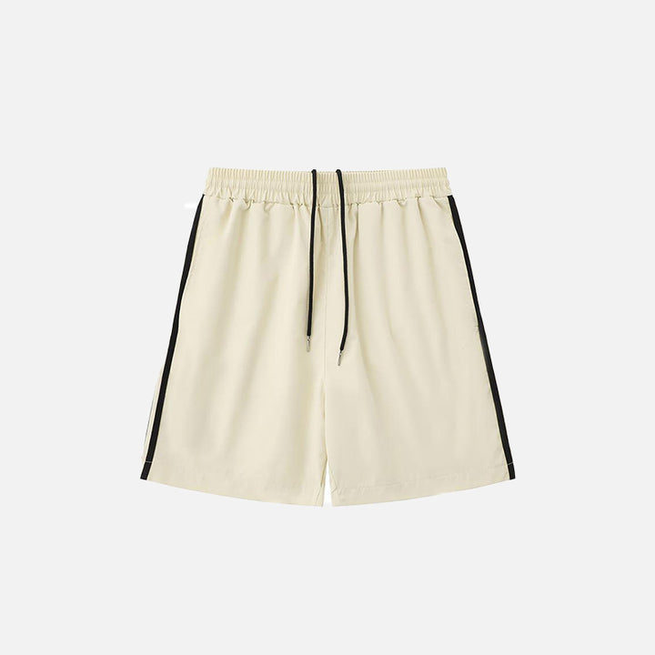 Front view of the beige Side Striped Sports Shorts in a gray background 
