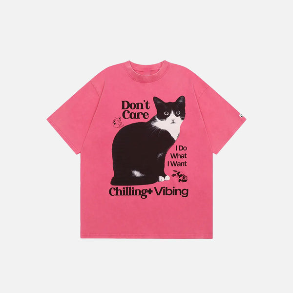 Front view of the pink Chilling Cat Graphic T-shirt in a gray background 
