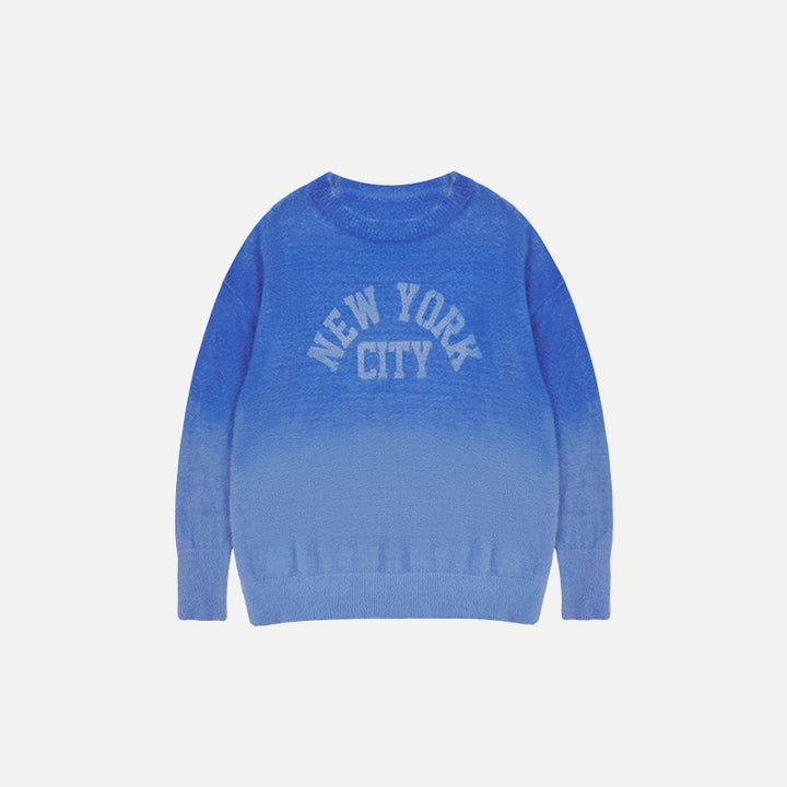 Front view of the blue Fluffy Fleece New York Sweater in a gray background 