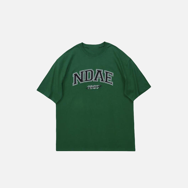 Front view of the green Oversized Loose T-Shirt in a gray background 