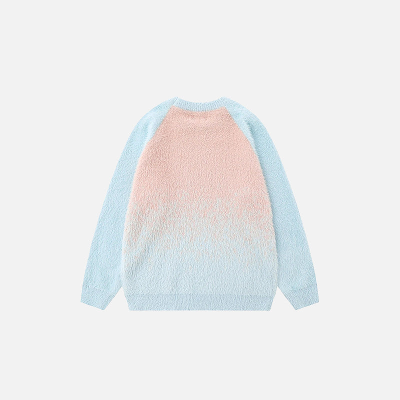 Back view of the blue Gradient Fade Sweater in a gray background