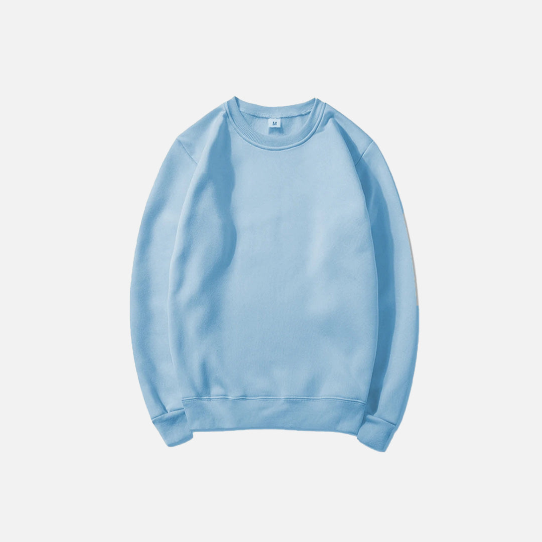 Front view of the light blue Essential Pullover Sweatshirt in a gray background