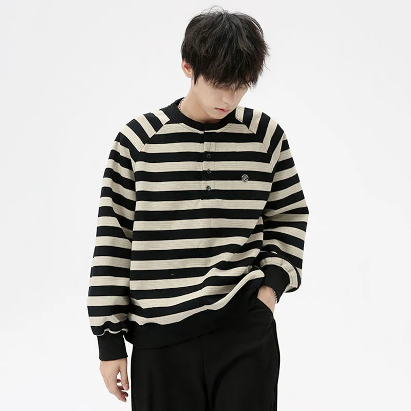 Model wearing the black Striped Long-Sleeve Sweatshirt