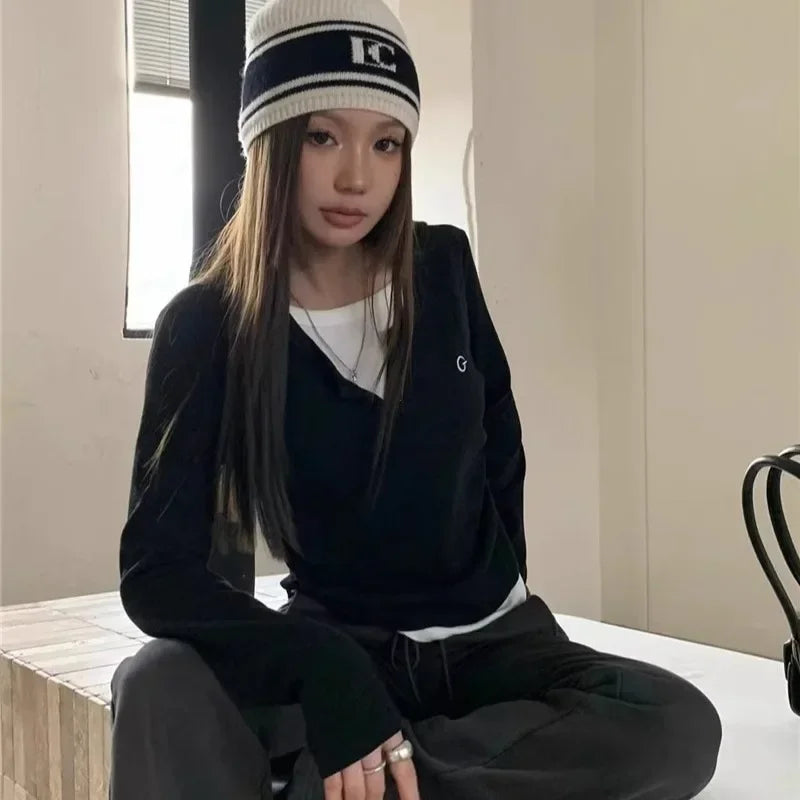 model wearing the black Long-Sleeve Logo T-Shirt