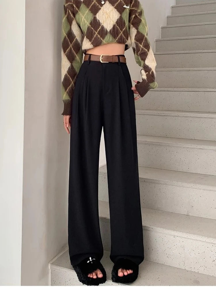 Model wearing the black High-Waisted Wide-Leg Pants