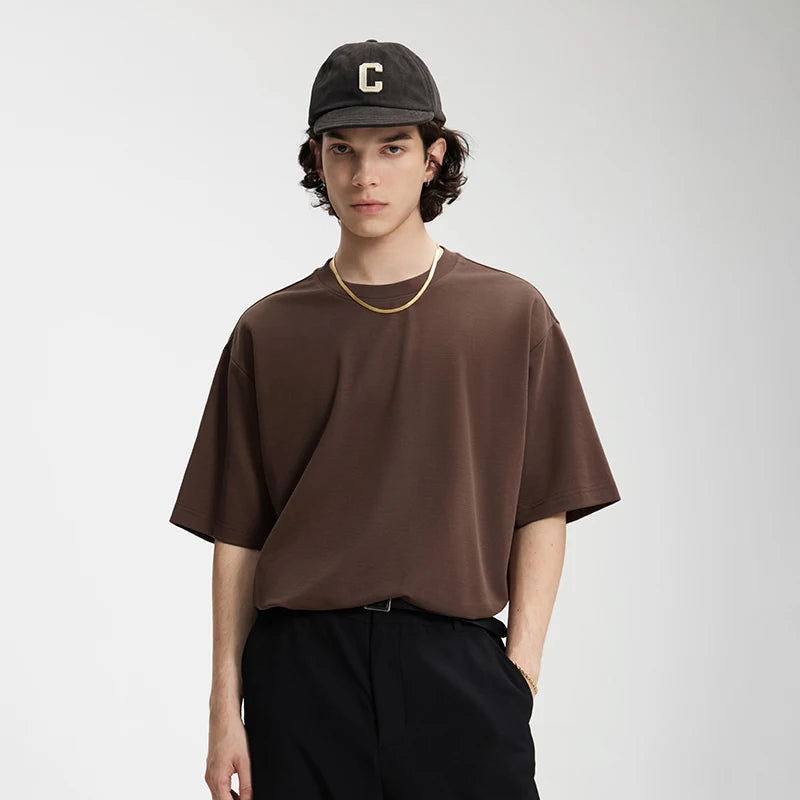Model wearing the brown Essential Everyday T-Shirt