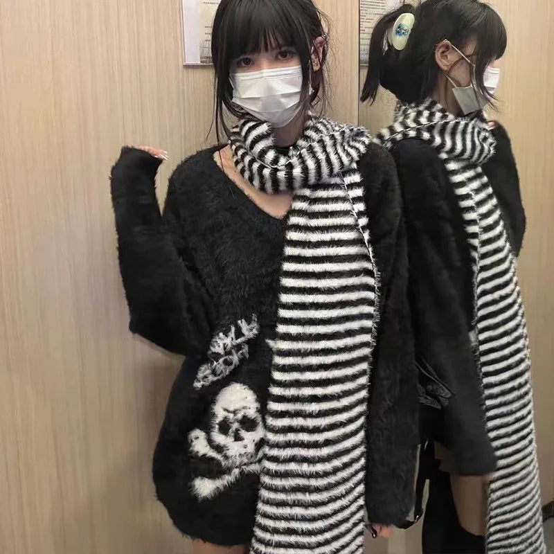 Modern wearing the black Skull Embrace Sweater