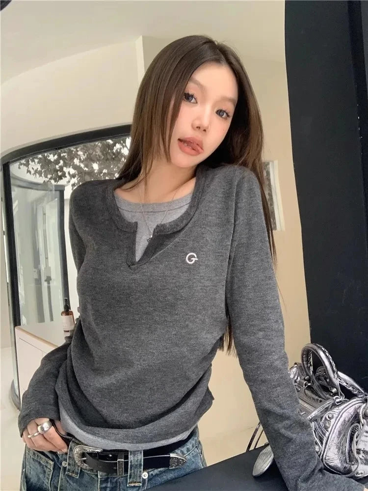 Model wearing the grey Groove Emblem T-Shirt