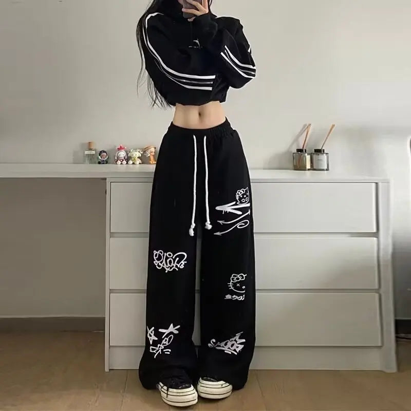Model wearing the black Y2K Graffiti Flow Pants