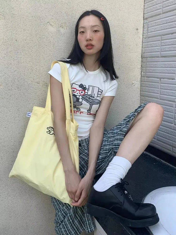 Model wearing the white Graphic Office Lady T-Shirt