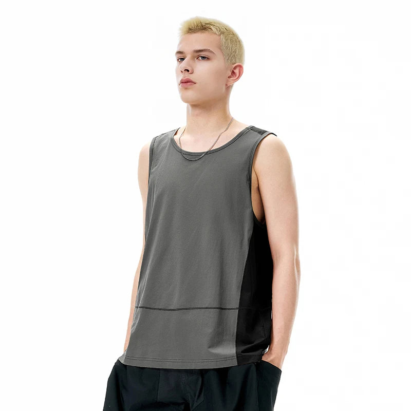 Model wearing the grey Urban Edge Tank T-Shirt in a gray background