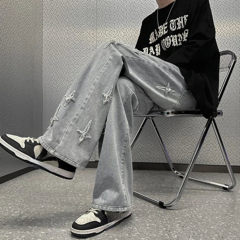 Model wearing the gray Y2K Embroidered Cross Denim Jeans 