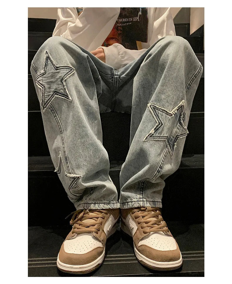 Model wearing the blue Star Embroidered Baggy Denim Jeans 