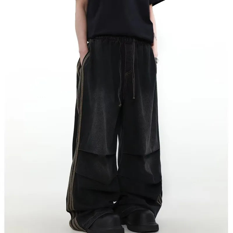 Model wearing the black Velvet Street Baggy Pants
