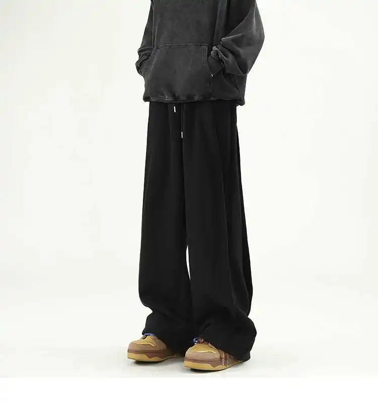 Front view of the black Loose Fit Pleated Sweatpants