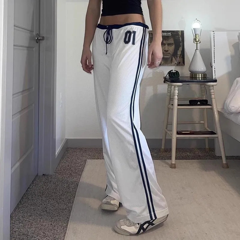 Model wearing the white Wide-Leg Athletic Pants 