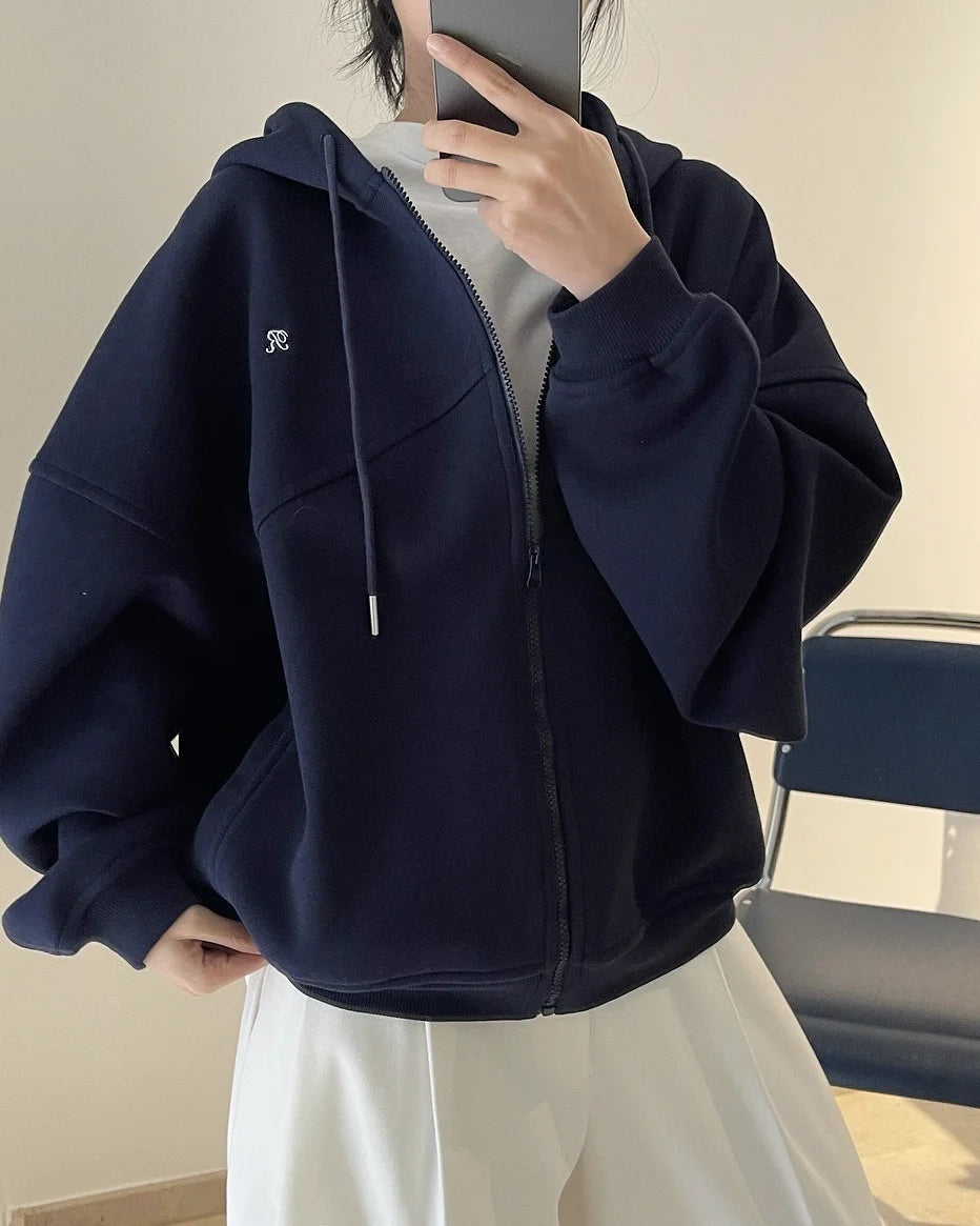 Front view of the navy blue Explorer's Dream Hoodie in a gray background 