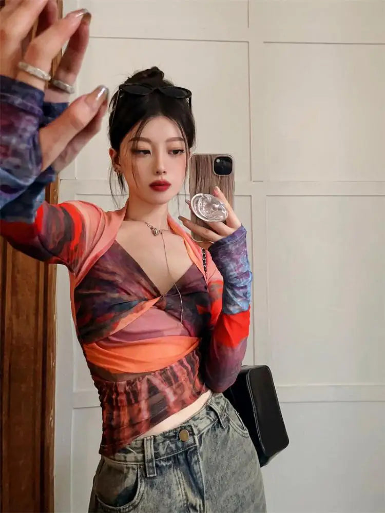 Model wearing the orange Mesh Long Sleeve Top