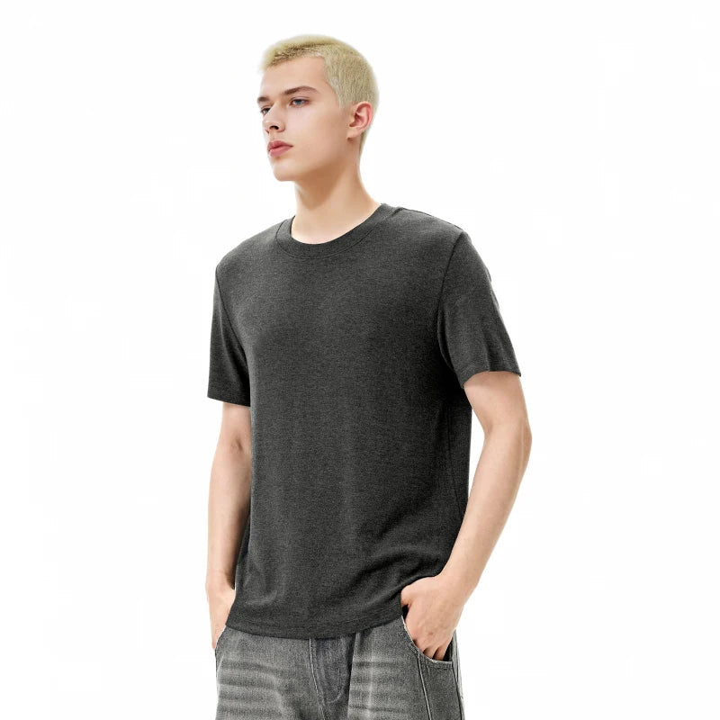 Model wearing the dark gray Timeless Drift T-Shirt in a gray background