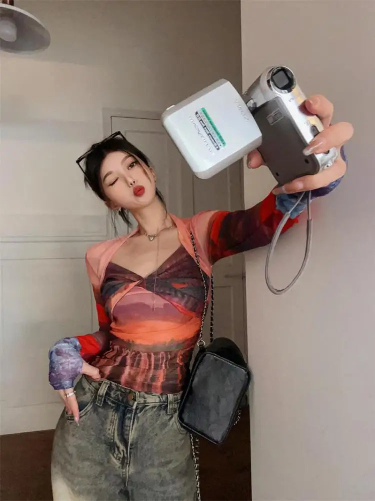 Model wearing the orange Mesh Long Sleeve Top