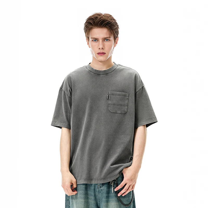 Model wearing the gray Classic Catchall T-Shirt in a gray background