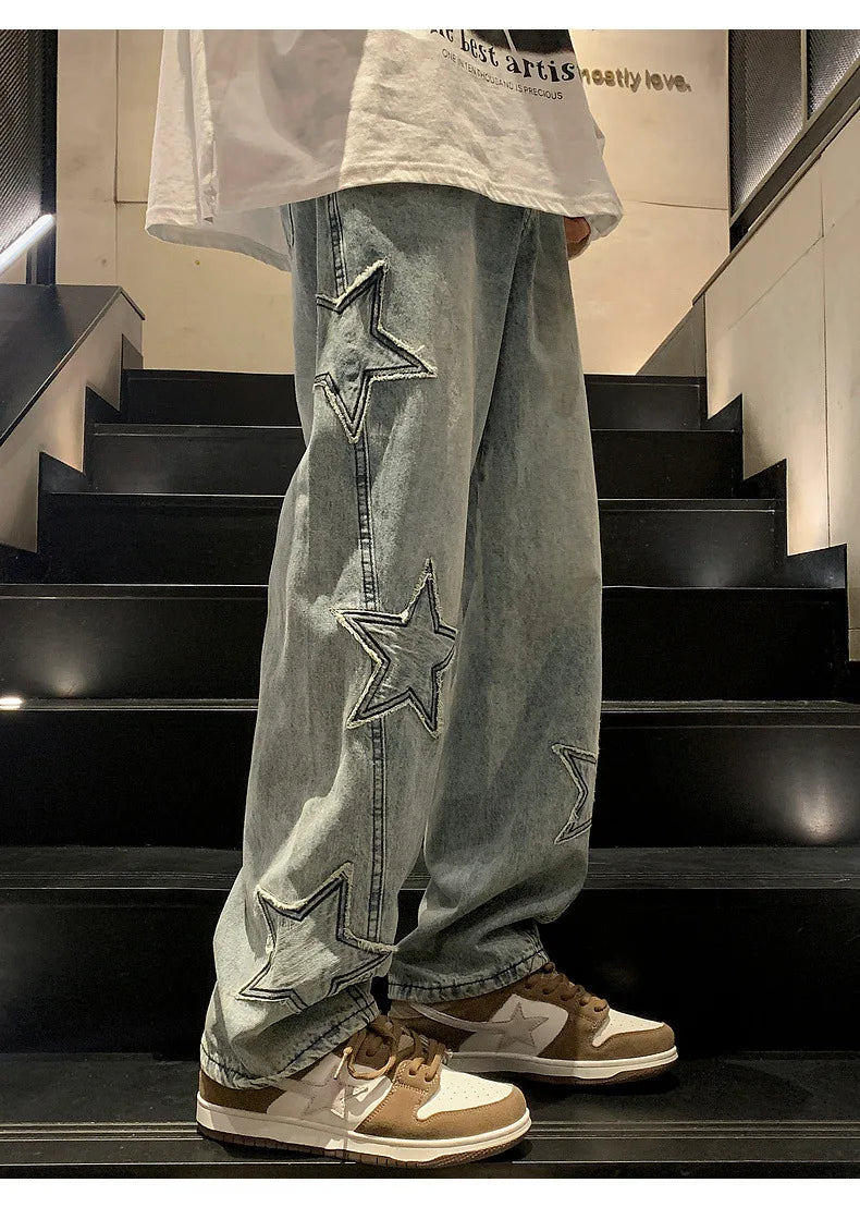 Model wearing the blue Star Embroidered Baggy Denim Jeans 