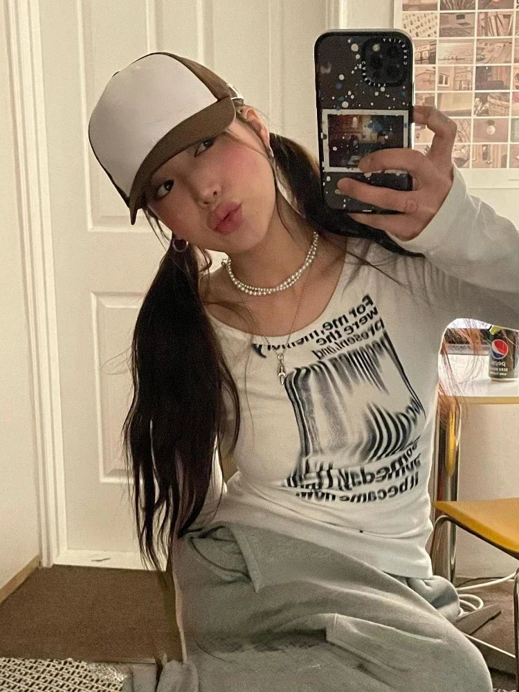 Model wearing the white Infinite Dreams Long-Sleeve T-Shirt