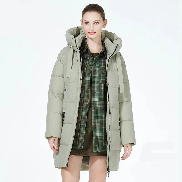 Model wearing the green Women's Padded Puffer Jacket in a gray background