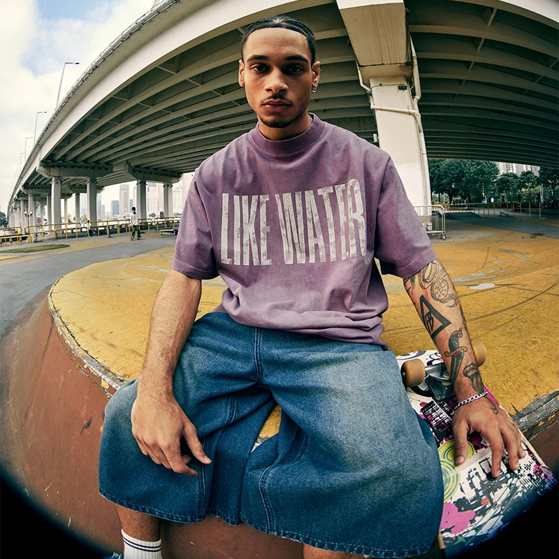 Model wearing the purple LIKE WATER T-Shirt