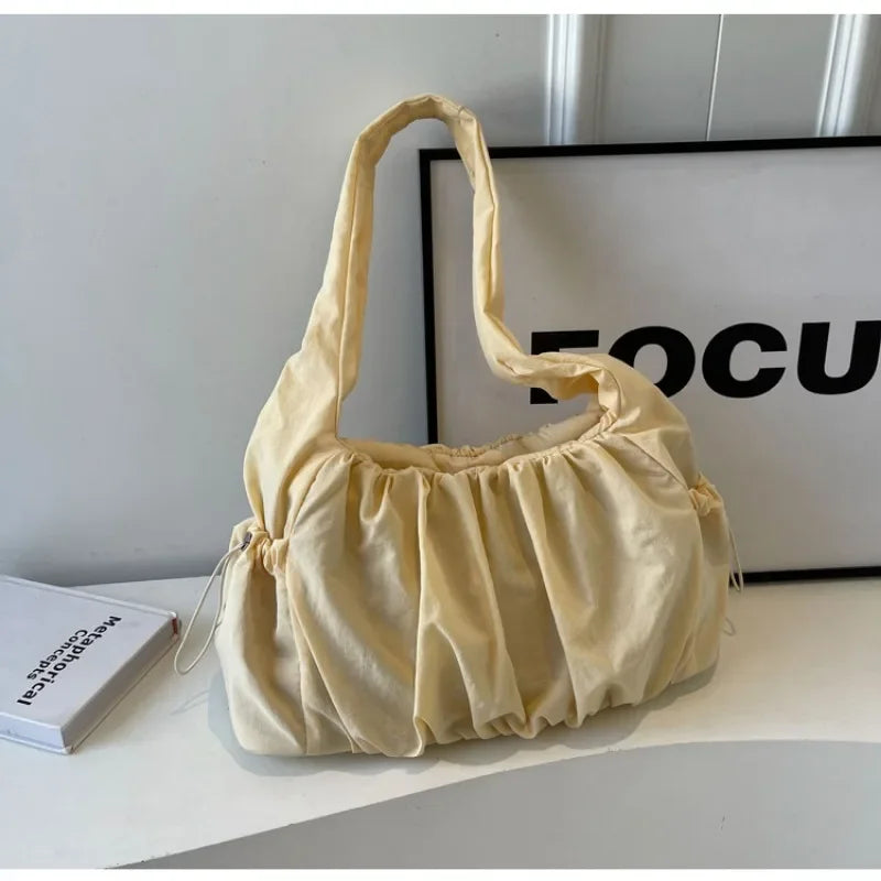 Front view of the yellow Wanderlust Sling Bag  