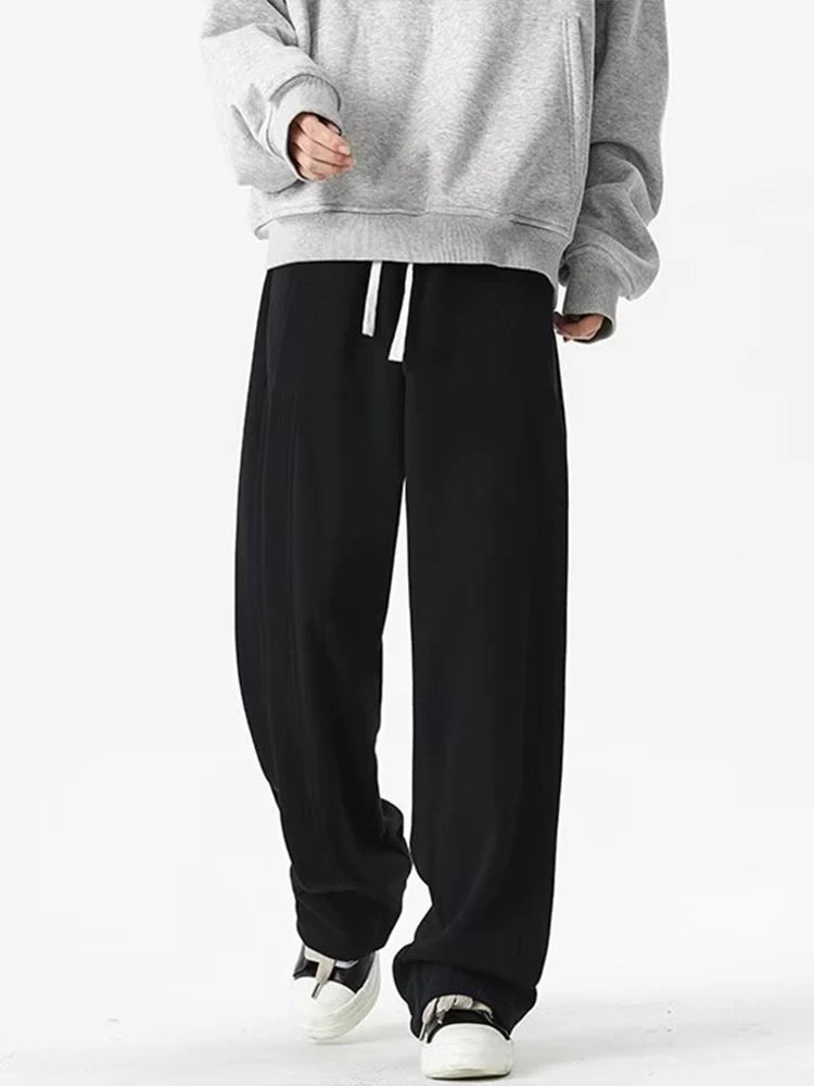 Front view of the black Loose Fit Pleated Sweatpants