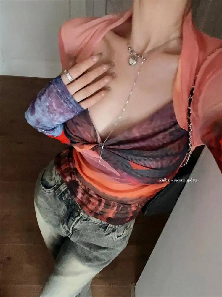 Model wearing the orange Mesh Long Sleeve Top