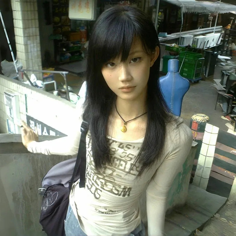 Model wearing the gray Long-Sleeve Graphic T-Shirt