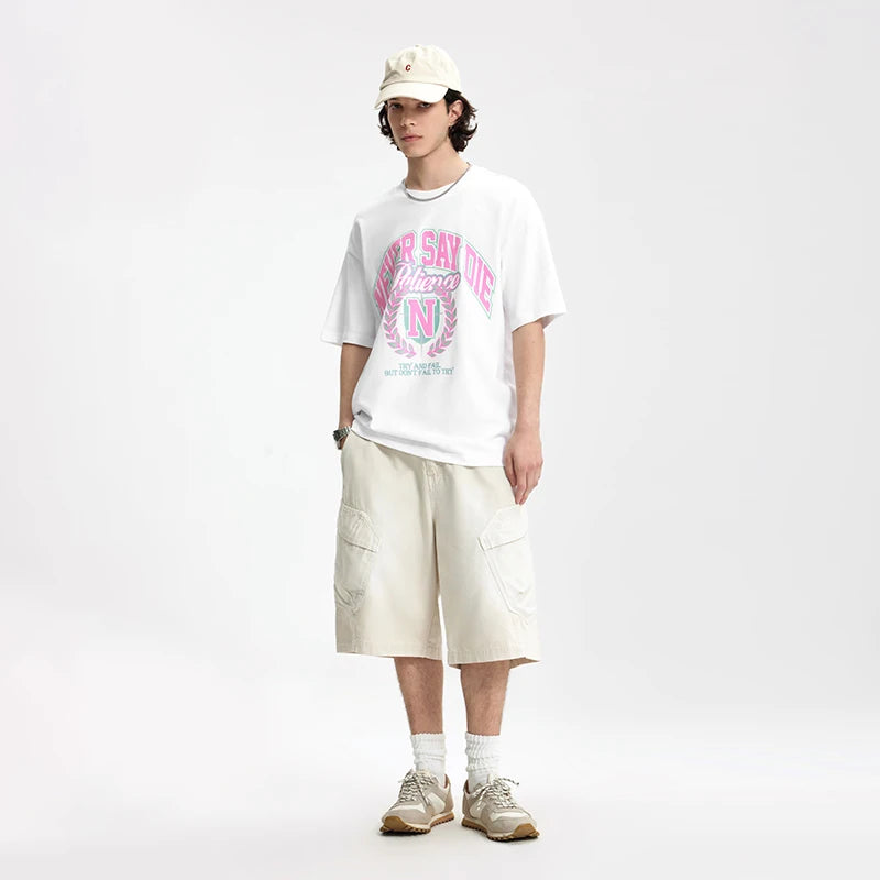 Model wearing the white Relentless Spirit T-Shirt in a gray background