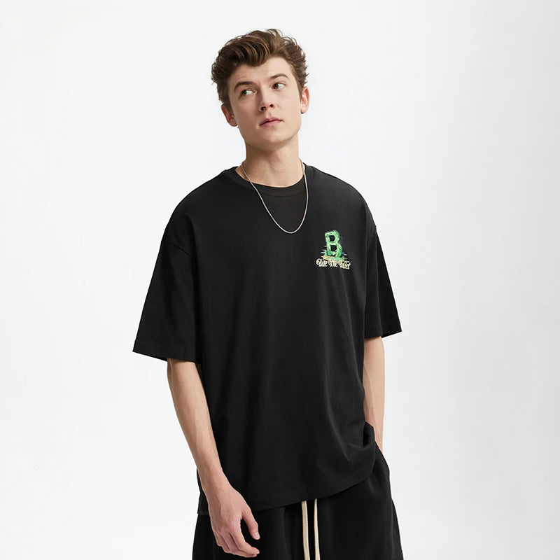 Model wearing the black Grizzly B Graphic T-Shirt