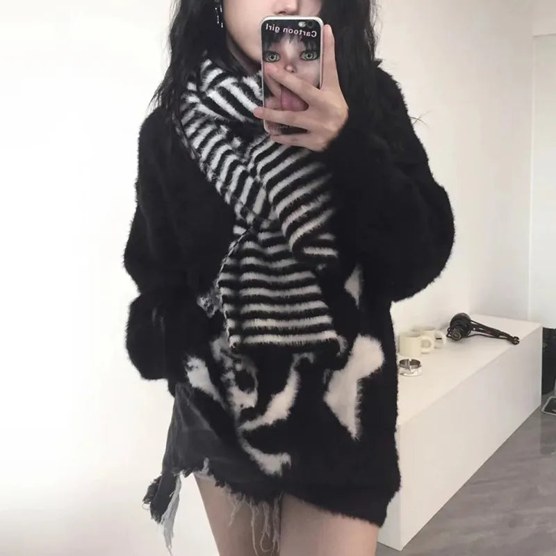 Modern wearing the black Skull Embrace Sweater