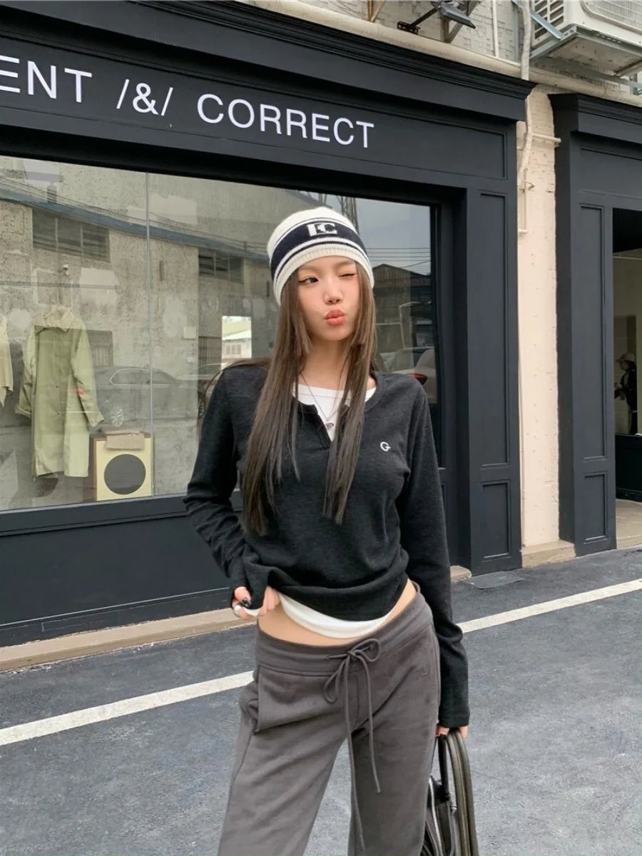 Model wearing the black Groove Emblem T-Shirt