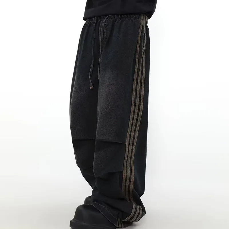 Model wearing the black Velvet Street Baggy Pants