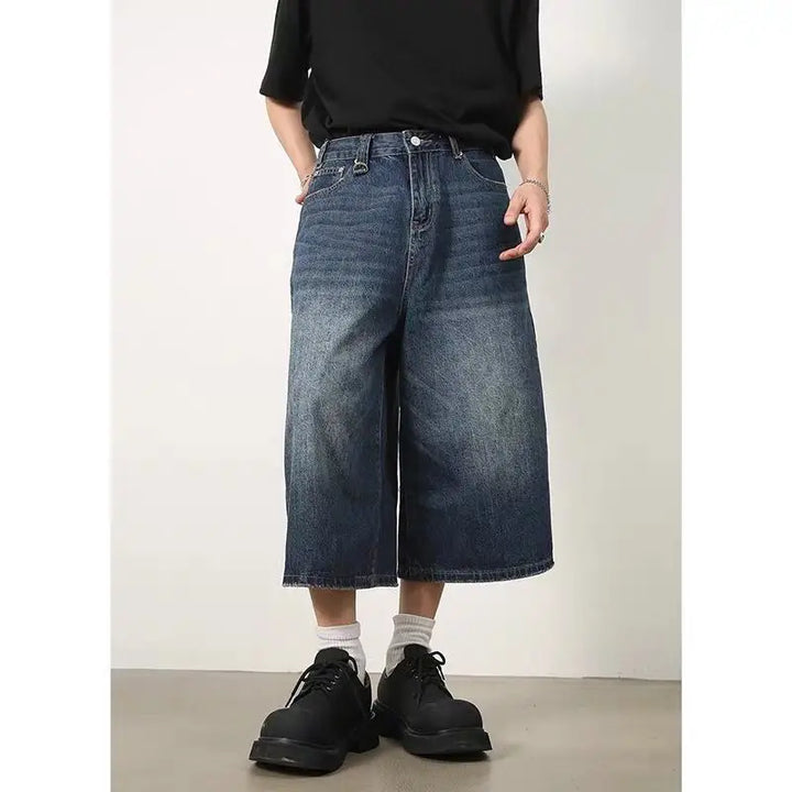 A model wearing the blue Vintage Washed Baggy Jorts from DAXUEN