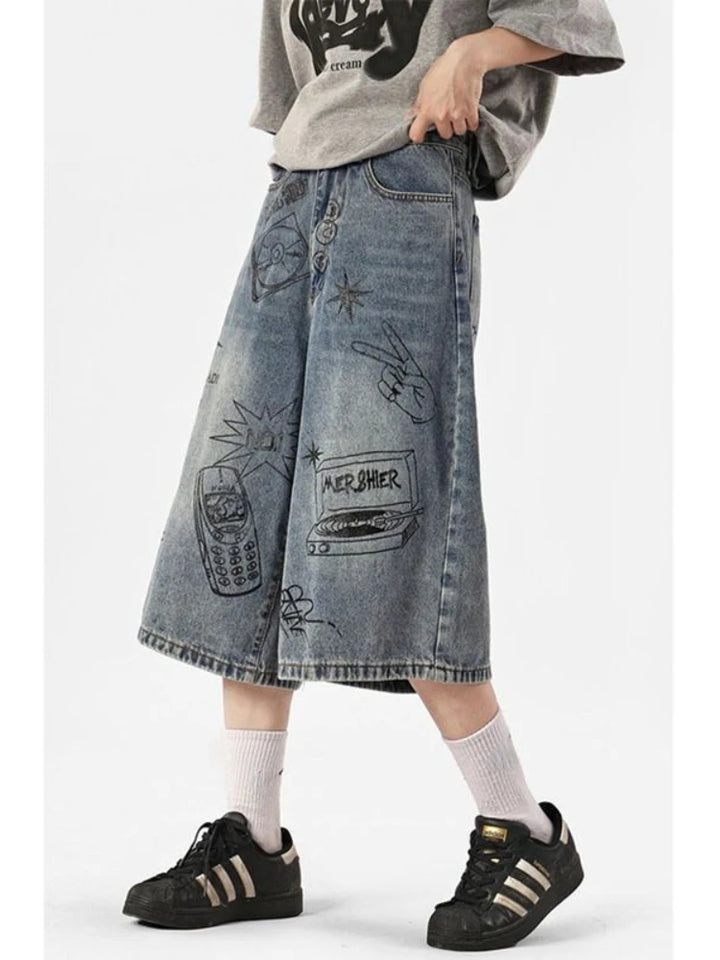 A model wearing the blue Y2K Women's Printed Washed Jorts in a gray background 