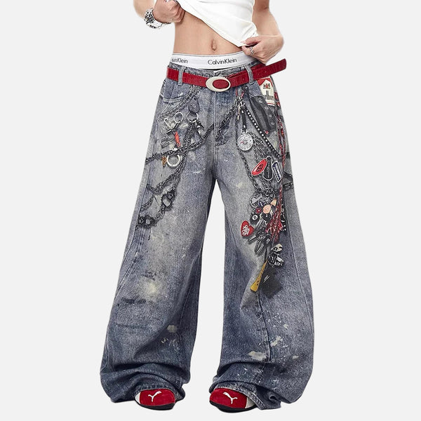 Wide-leg jeans with decorative elements and a red belt on a white background